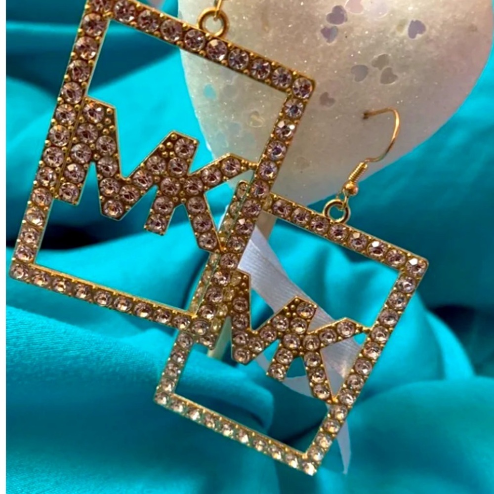 MK dangle earrings